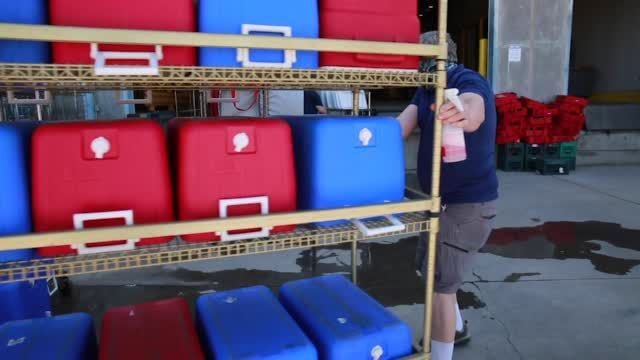 Watch now: TUSD Food Services unload buses after grab-and-go program